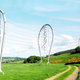 Illustration for article titled These Beautiful Giant Sculptures Support Power Lines With Style